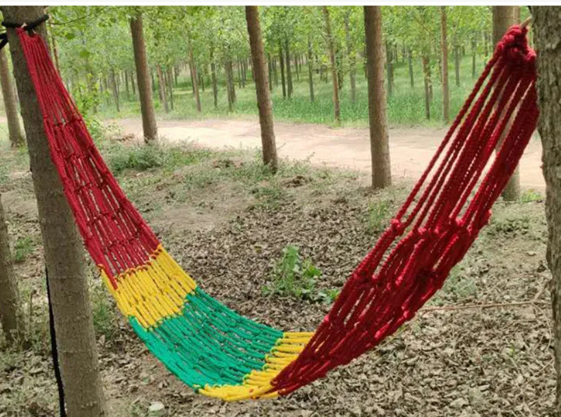Nylon rope mesh hammock with tying system shown outdoors