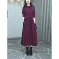 A purplish red plus size long dress with long sleeves for women in autumn and winter.