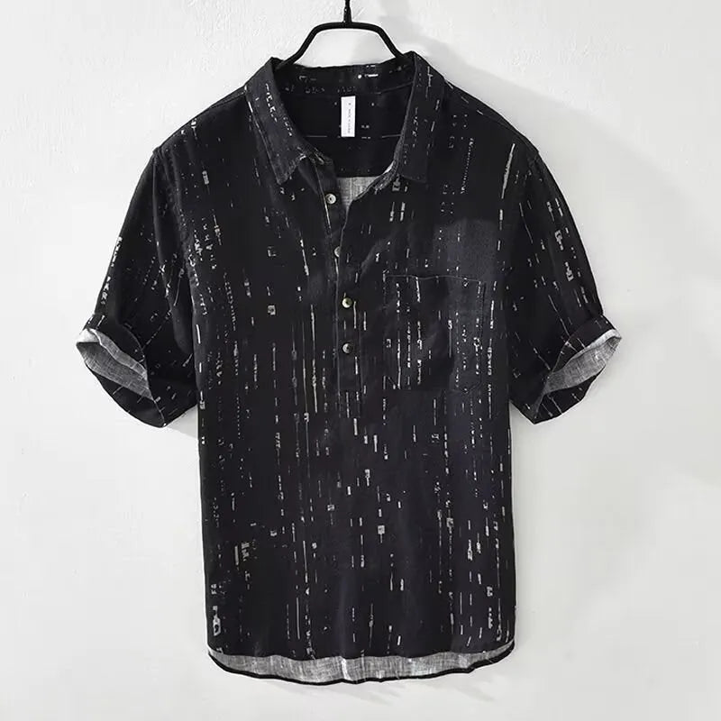 Men's loose fit short sleeve polo shirt in black, shown on a model.