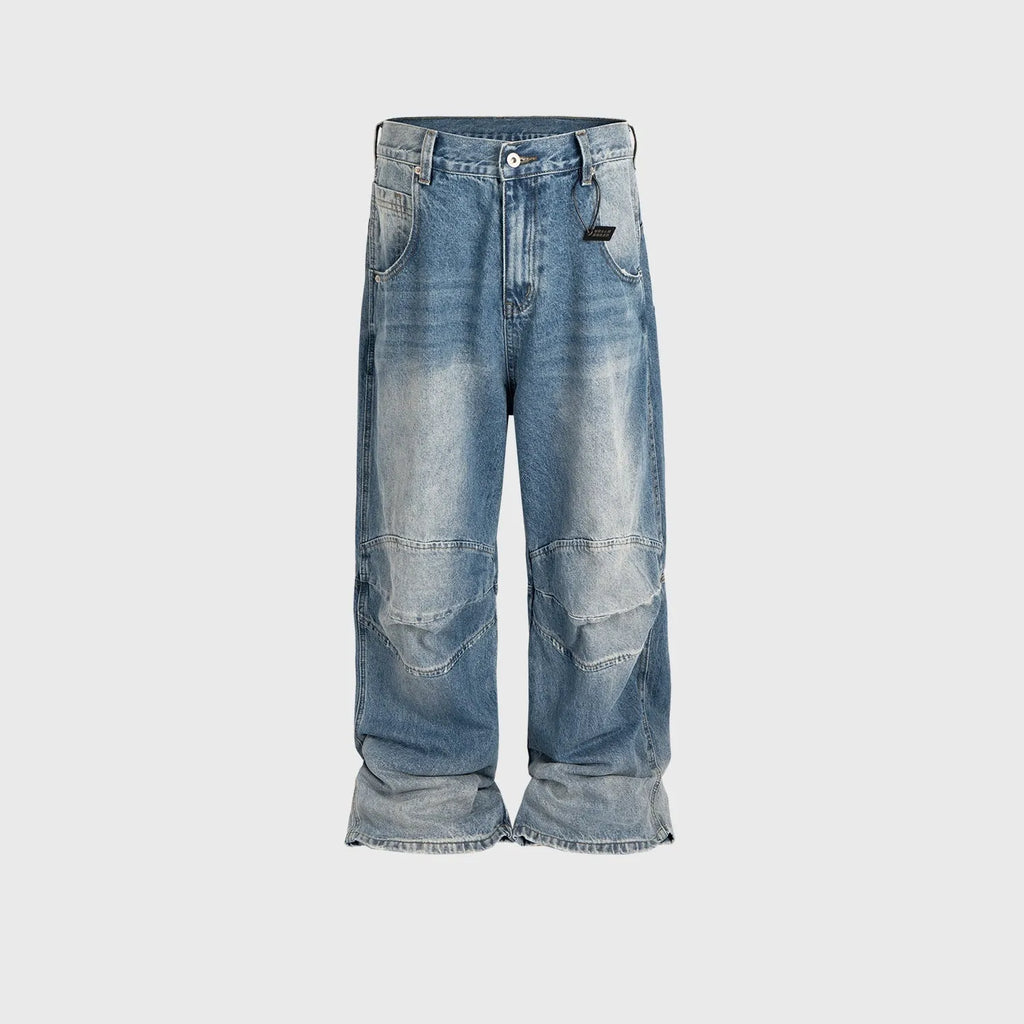 Baggy washed blue straight-leg jeans with zip fly on mannequin