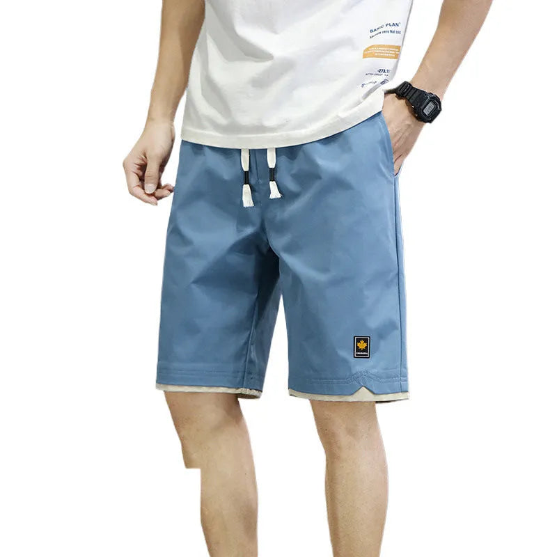 Casual loose-fit beach shorts in green with a straight cut and elasticated waistband