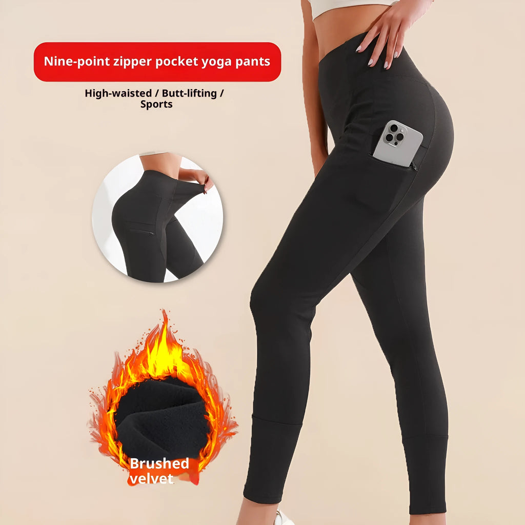 Black cropped leggings with high waist and zipper pocket on a model