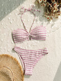 Women's pink and black striped bikini swimsuit with briefs style on a mannequin.