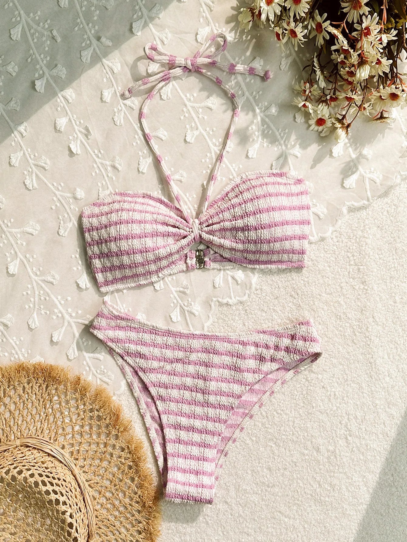 Women's pink and black striped bikini swimsuit with briefs style on a mannequin.