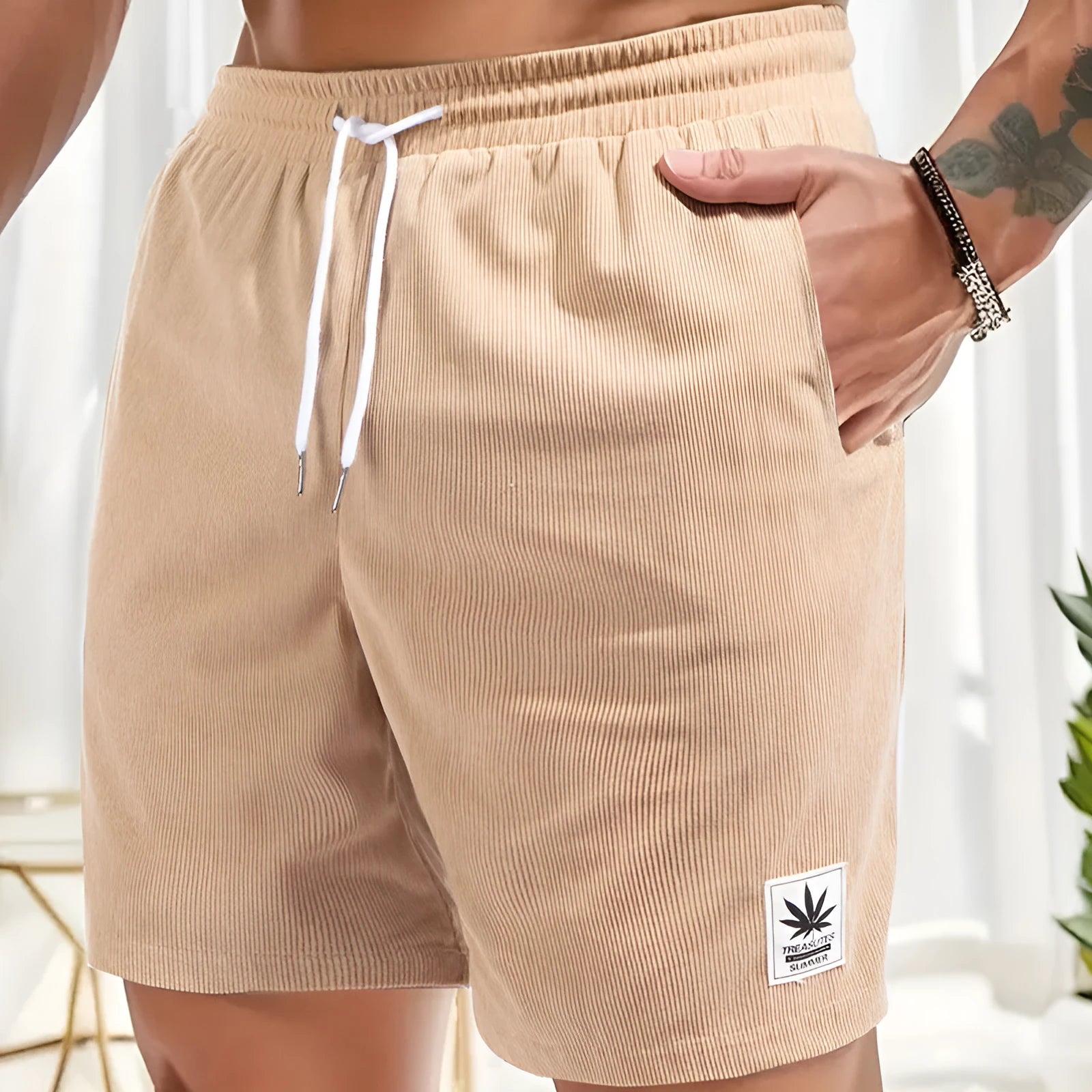 Men's black drawstring summer shorts with straight leg on a mannequin