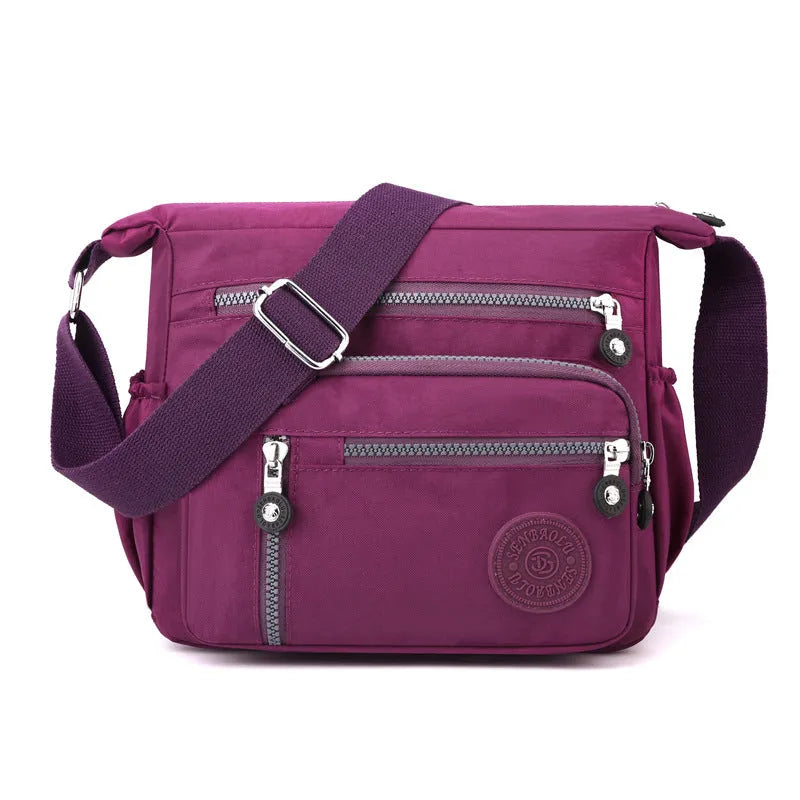 Grey nylon messenger bag with single shoulder strap showing square vertical shape