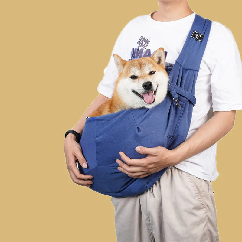 Folding cat carrier backpack shown in blue with large mesh ventilation windows and adjustable shoulder straps