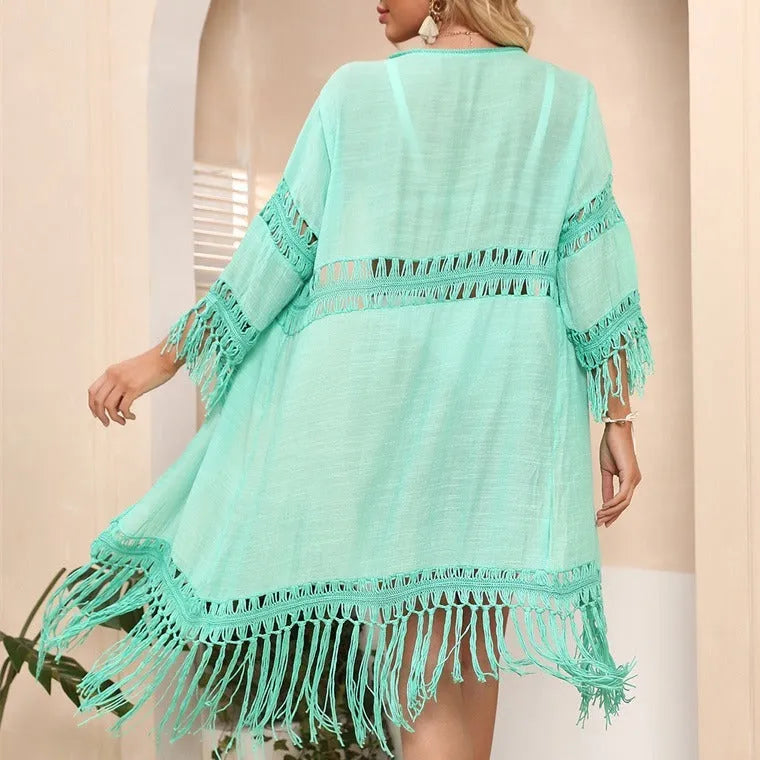 Yellow loose-fitting crochet cardigan with tassels, a women's beach cover-up.