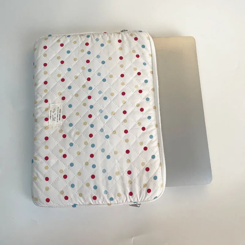 Women's polka dot laptop bag in breathable polyester with size options for computer protection