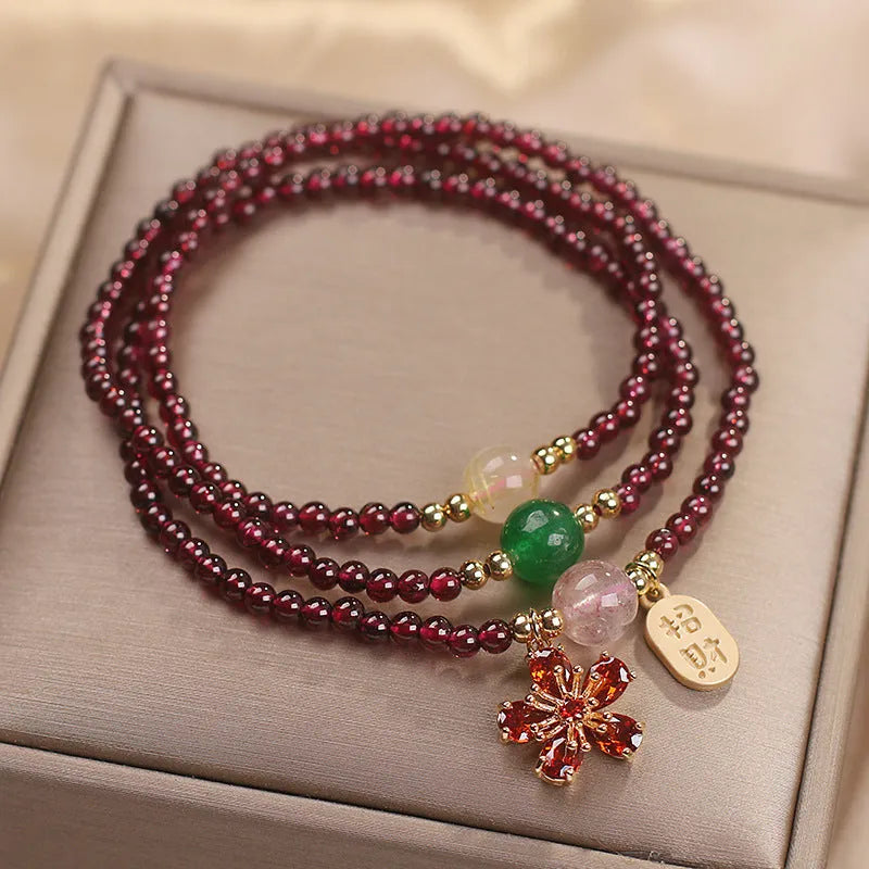 Natural crystal bracelet in pomegranate red and cherry blossom colours with sequin bead accents for women