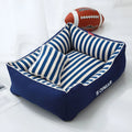 Navy stripes dog crate mat and matching fabric pillow set on a white background.