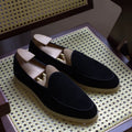 British handmade men's genuine leather loafers in various colours on a flat shoe sole.