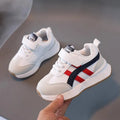 Children's white casual sneakers with Velcro fastening, synthetic leather upper, and rubber sole