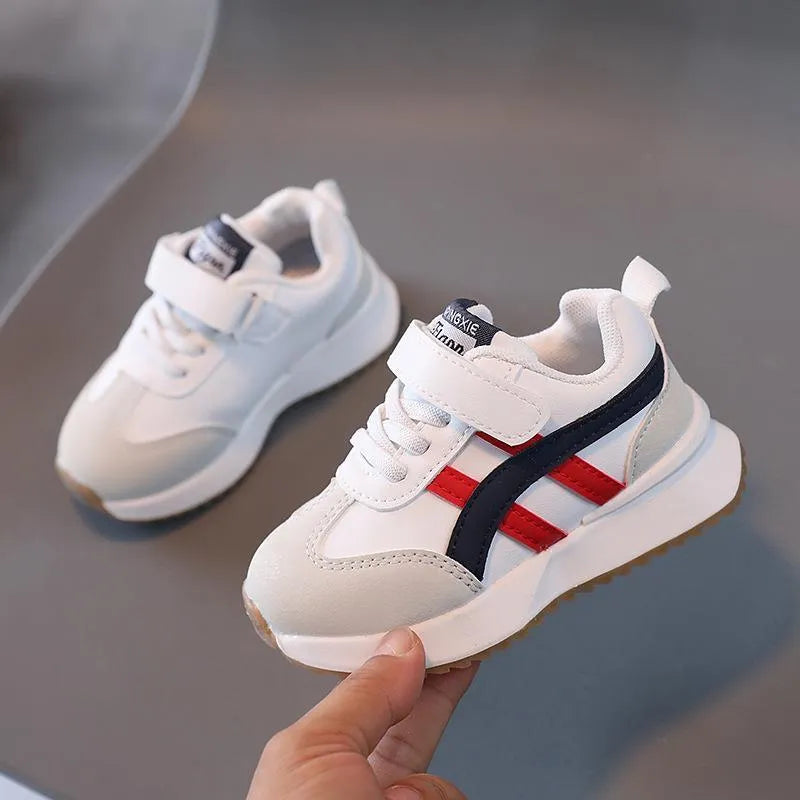 Children's white casual sneakers with Velcro fastening, synthetic leather upper, and rubber sole