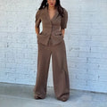 Brown men's two-piece formal suit with slim fit waist and long sleeves.