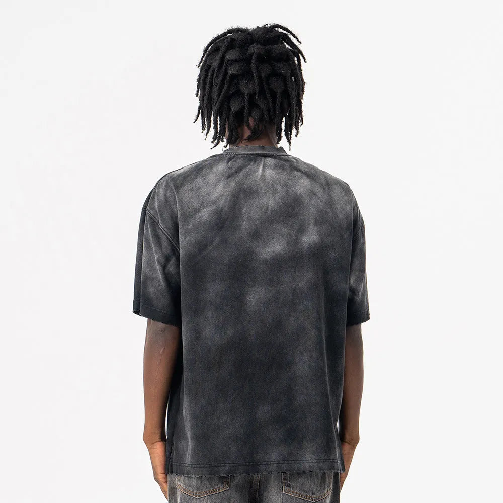 Black men's t-shirt with printed letters, loose fit and drop-shoulder sleeves in washed cotton fabric