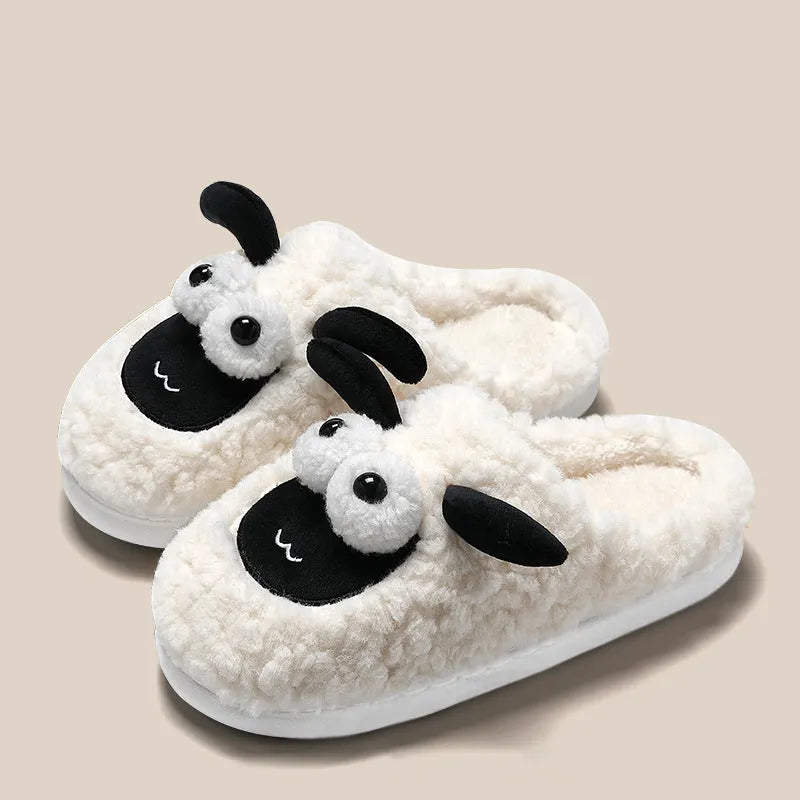 Brown lamb thermal cotton slip-on slippers with suede upper and PVC sole on a wooden floor.