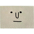 Square cartoon geometric pattern floor mat in Mr. Big Nose colour on a home floor.