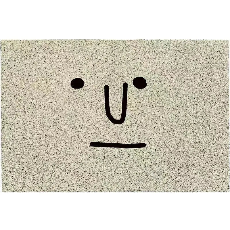 Square cartoon geometric pattern floor mat in Mr. Big Nose colour on a home floor.
