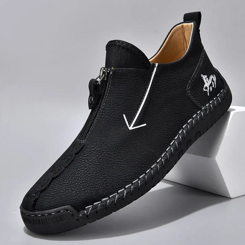 Men's black front zip Martin boots with hand-stitching on artificial PU upper and rubber sole.