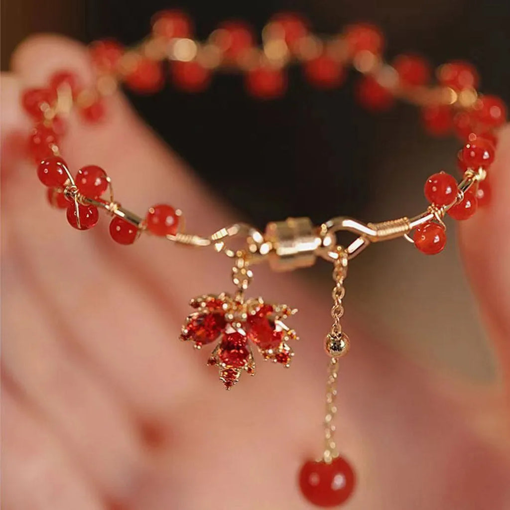 Red ginkgo leaf charm on a silver-toned magnetic alloy bracelet in Chinese natural style.