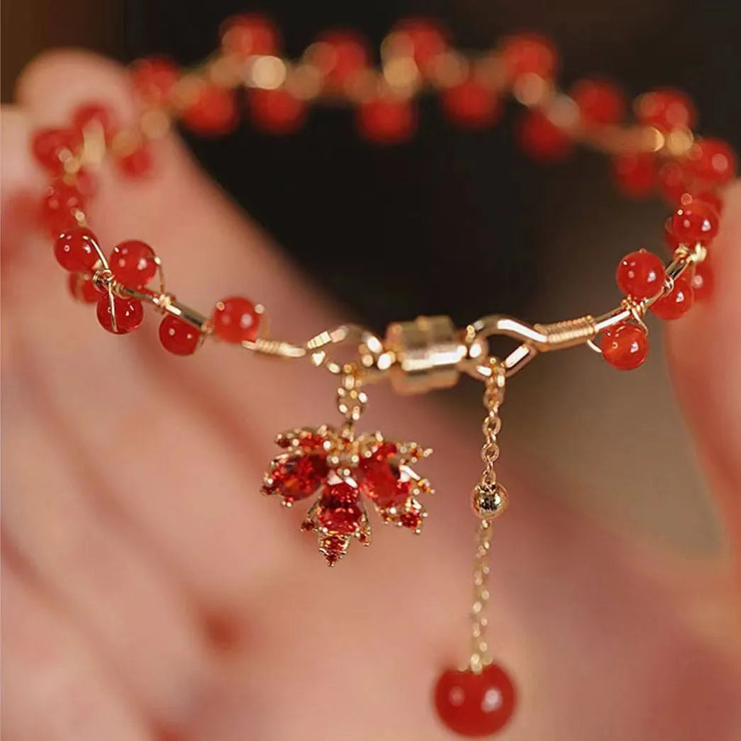 Red ginkgo leaf charm on a silver-toned magnetic alloy bracelet in Chinese natural style.