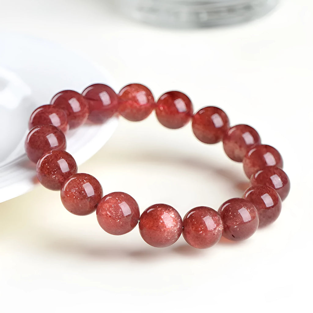 Natural strawberry quartz crystal bracelet with polished red geometry beads, shown in 3A and 5A grade options.