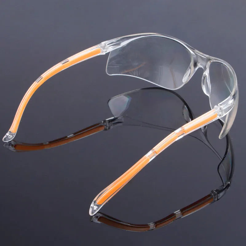 Transparent safety goggles with yellow tinted polycarbonate lenses for lab and welding protection.