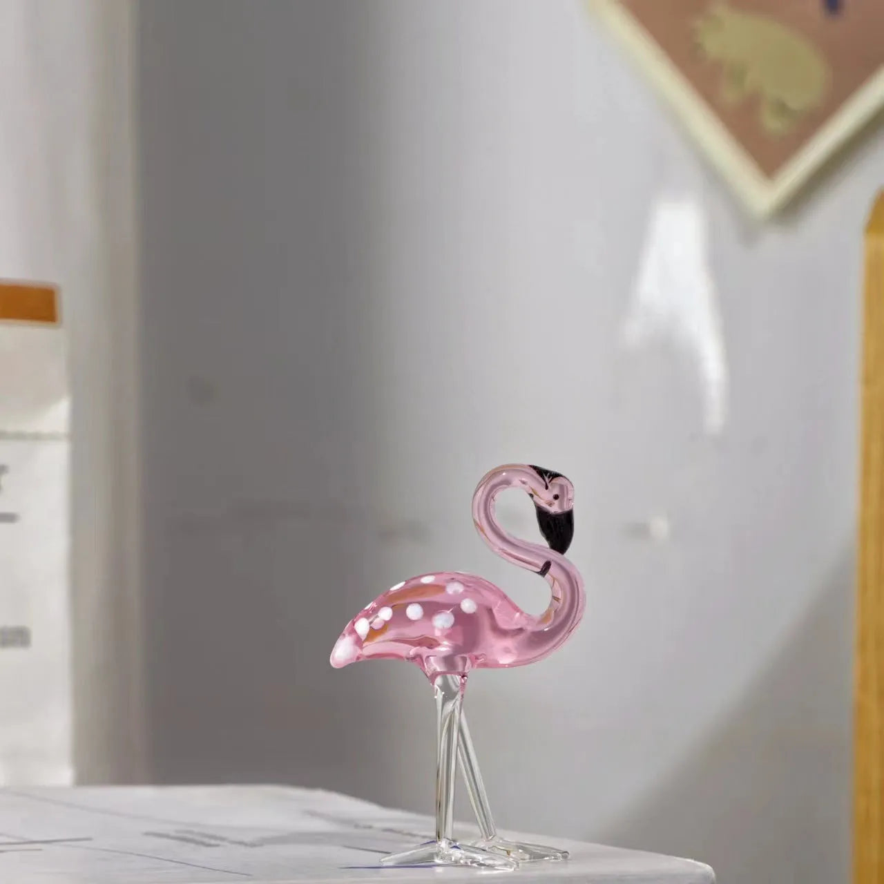Pink crystal flamingo decorative ornament on table with modern simple design