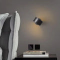 Modern simple style copper wall lamp in gold or black finish for living room.