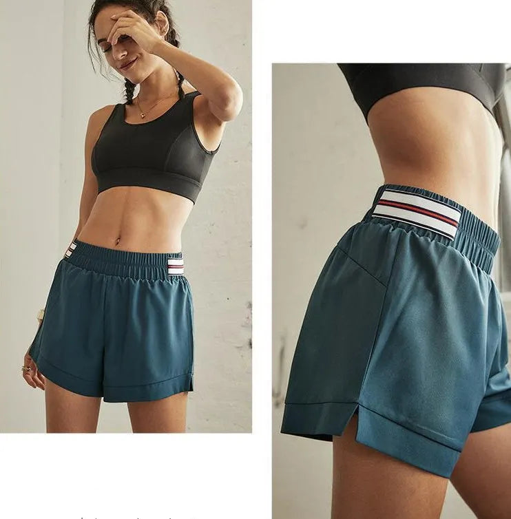 Green women's fitness yoga shorts with elastic waistband, plain design, size S M L