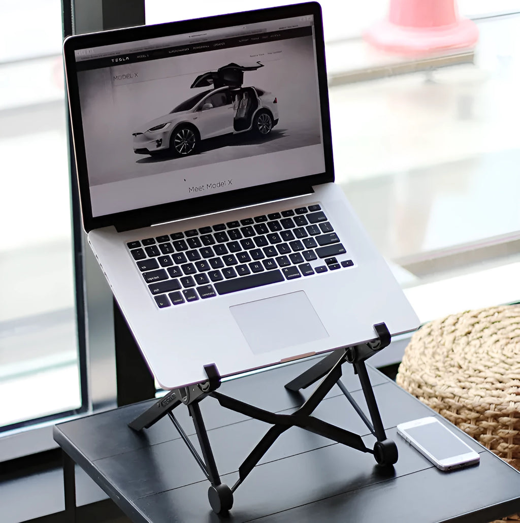 Black folding laptop stand showing folded and unfolded positions with reinforced nylon construction