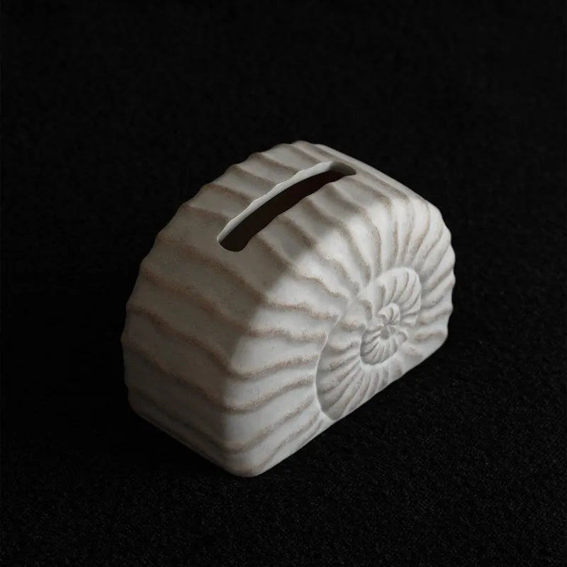 Resin conch ramble decorative tissue box cover with seashell design.