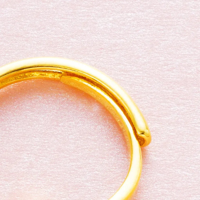 Women's adjustable copper ring with electroplated finish in one of six colours: black, blue, green, pink, red, or white.