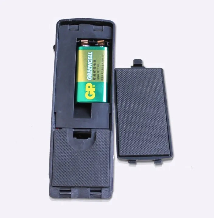 Black portable wedge-shaped door stop alarm with a stainless steel cover for home and travel security.