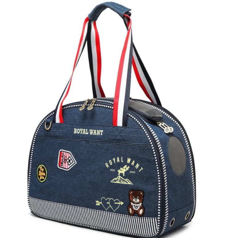 Blue denim pet carrier bag with cartoon pattern, measuring 43cm by 20cm by 30cm.
