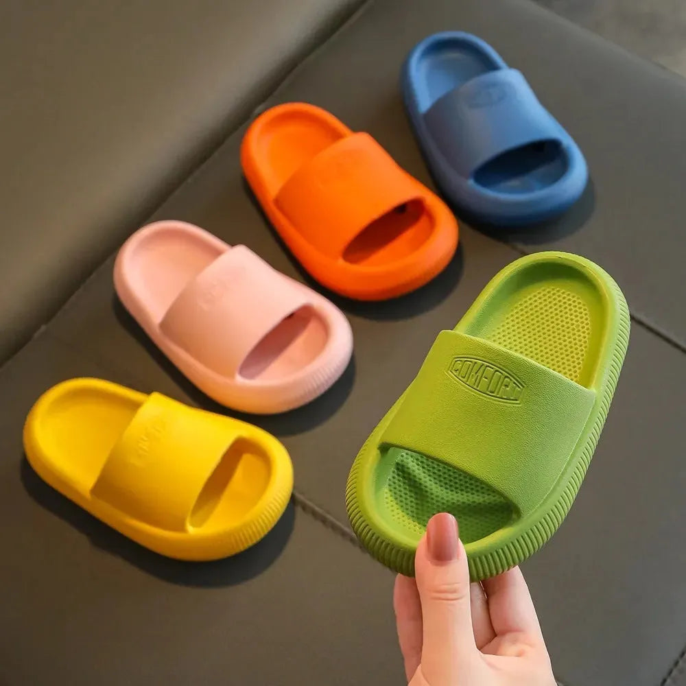 Children's mixed colour EVA slippers with a non-slip sole, shown in blue, green, orange, pink, and yellow.
