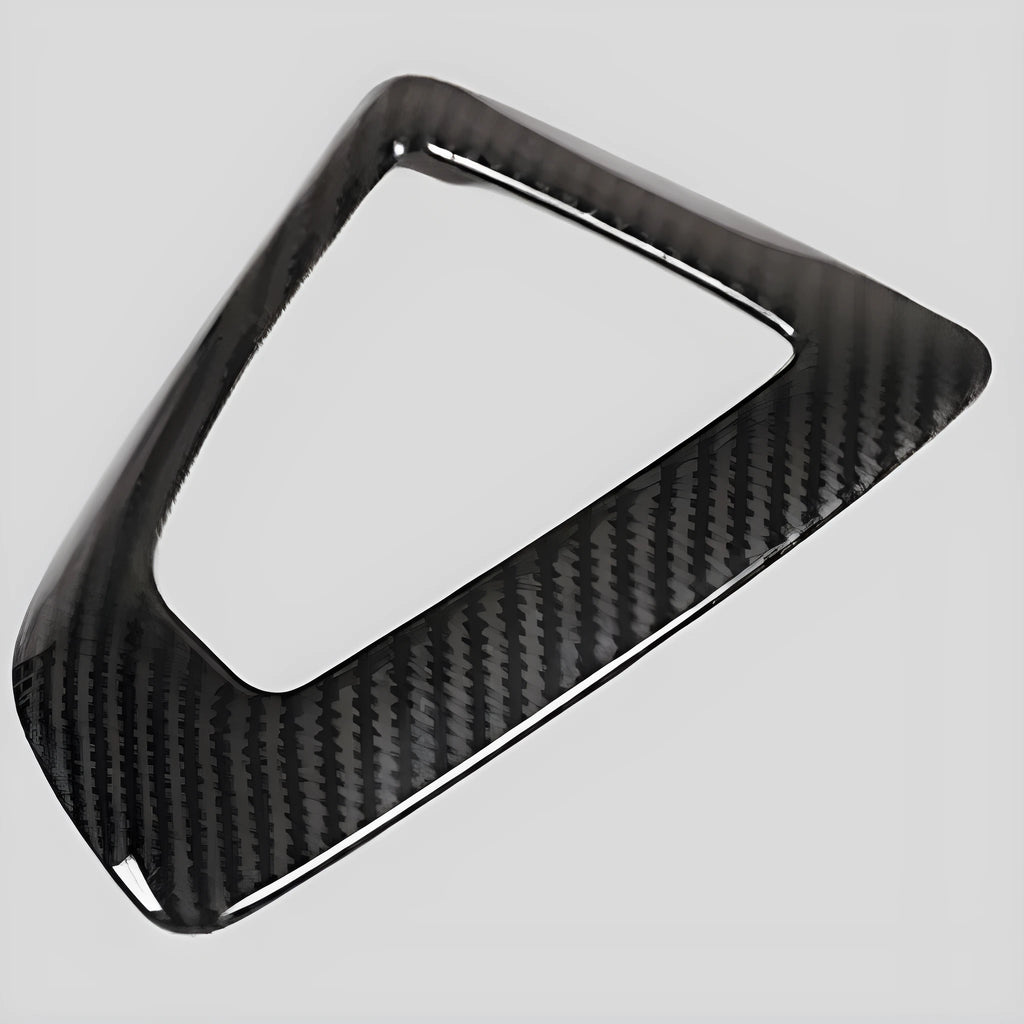 BMW gear base frame in left titanium colour with carbon fibre pattern, showing 3M adhesive backing.