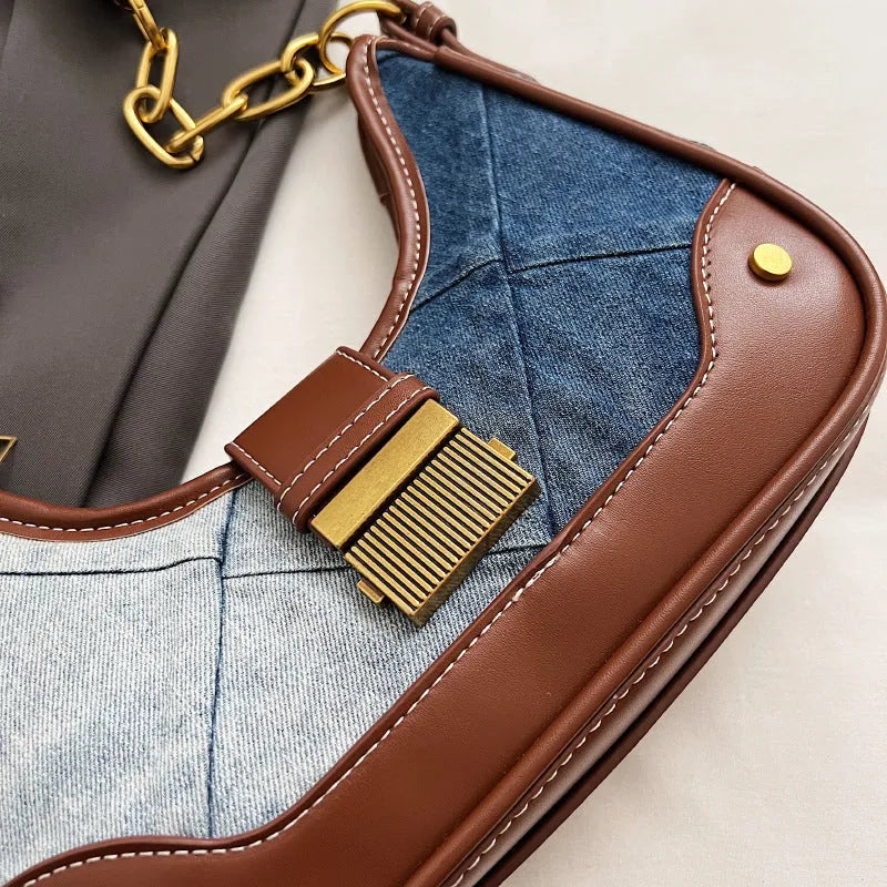 Brown denim women's bucket shoulder bag with diamond mesh, chain detail, and double straps.