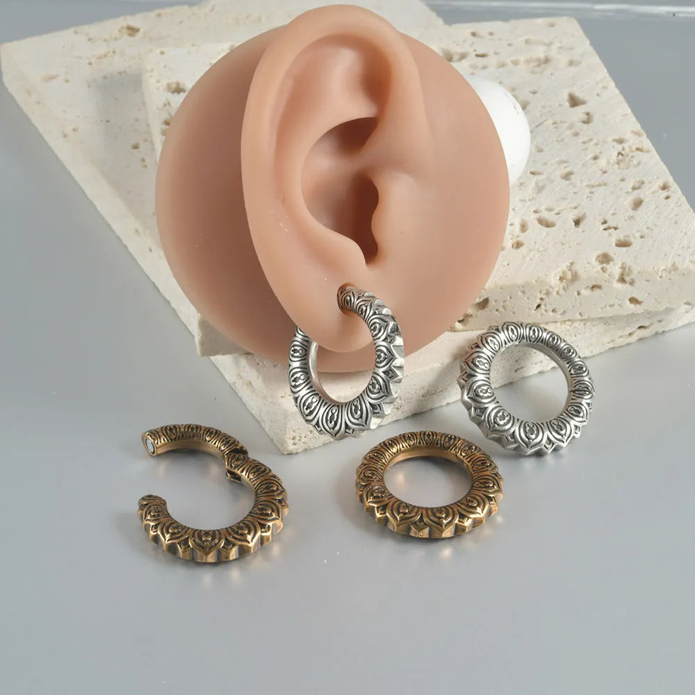 Large antique silver dragon-shaped hollow-out auricle earrings made from stainless steel.