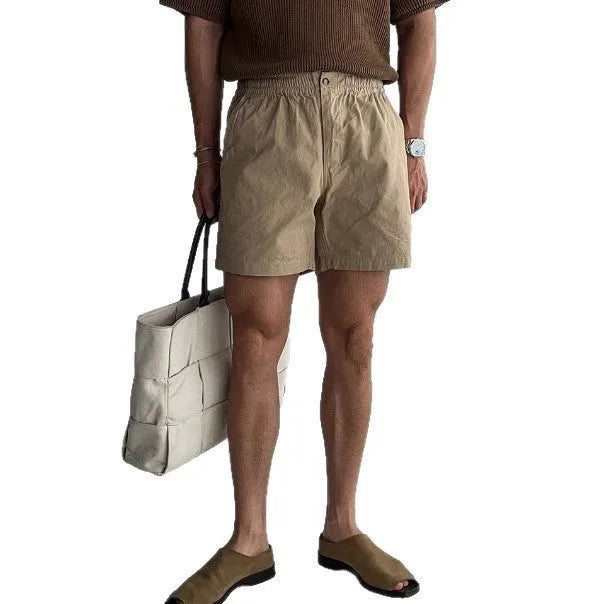 Cotton sports shorts in loose fit design shown in black, white and khaki colours