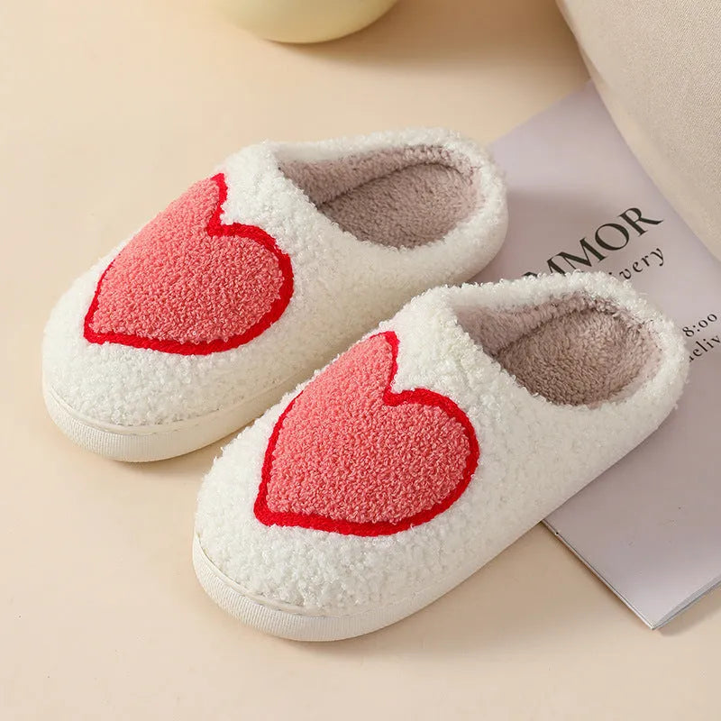 Women's plush cartoon love style home slippers in multiple colours with a non-slip PVC sole.
