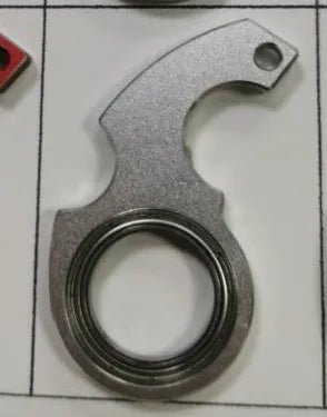 Metal texture rotating keychain in karambit style with key ring in black colour