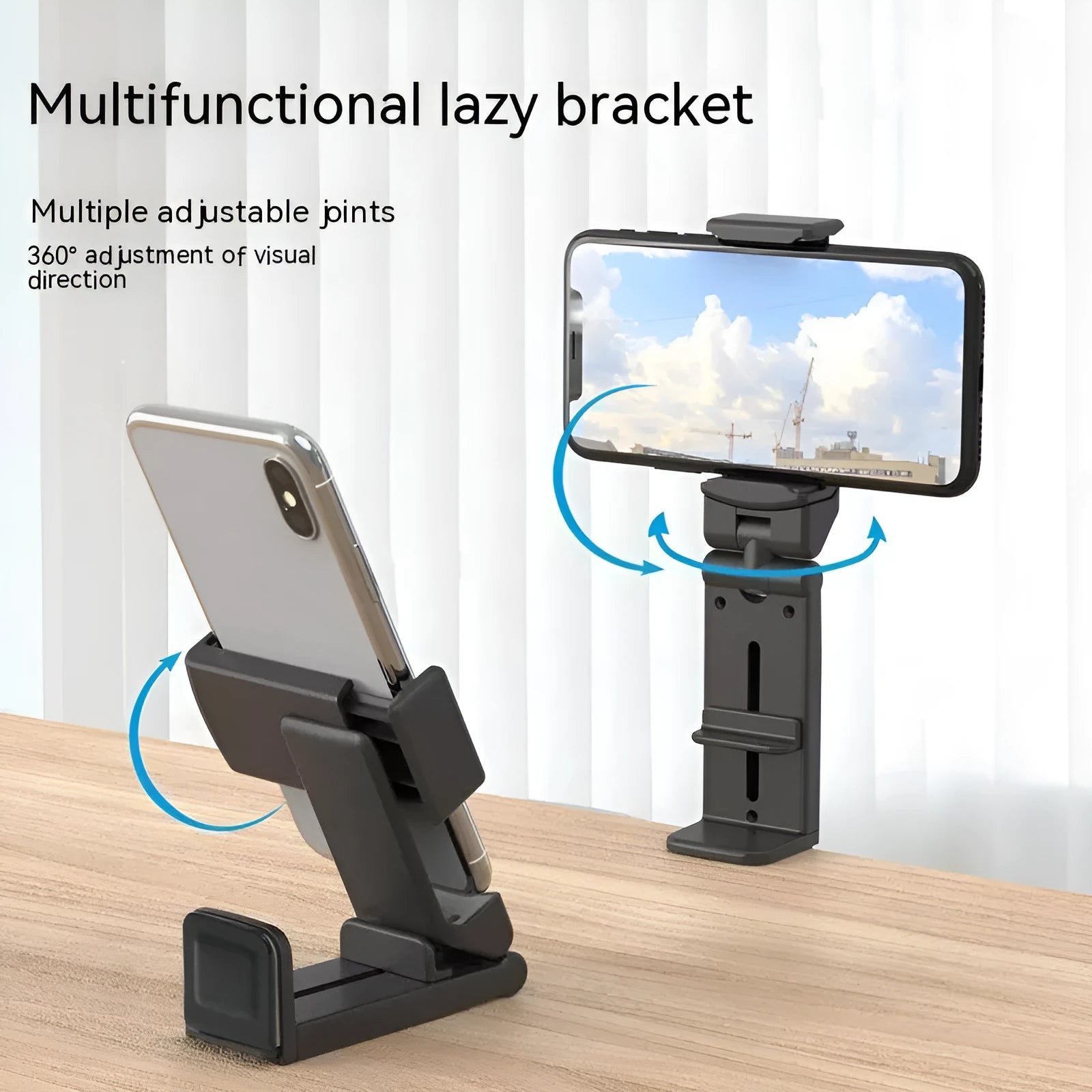 Black 360-degree rotating collapsible phone holder on desktop showing adjustable viewing angles