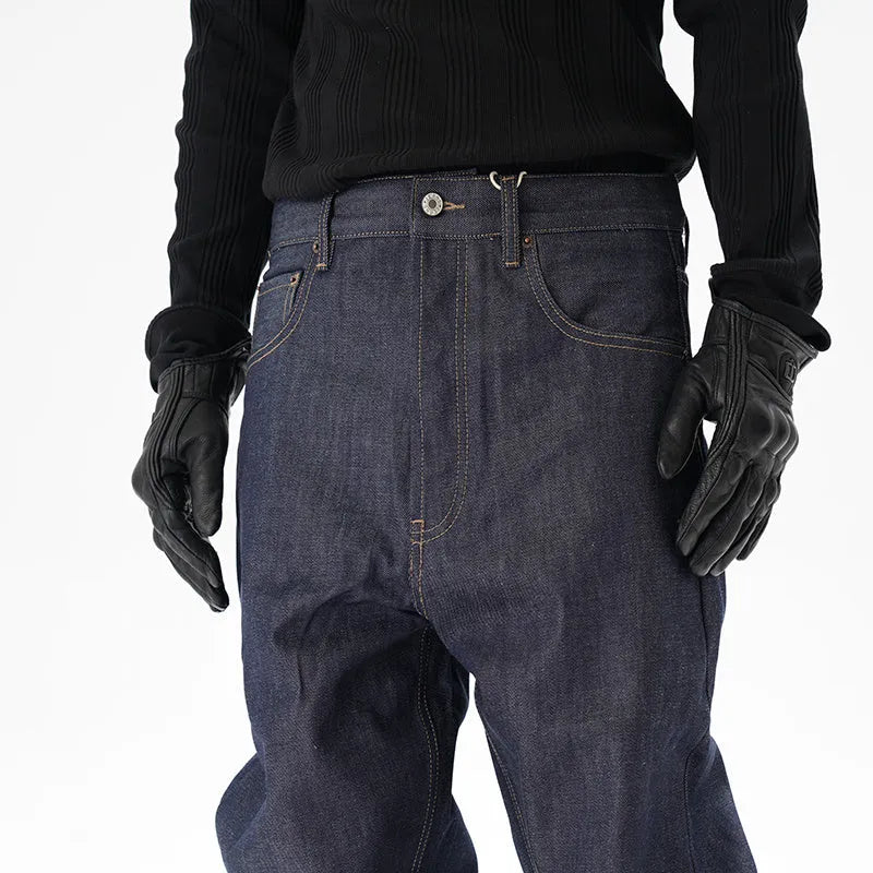 Man wearing dark blue loose straight-leg casual jeans.