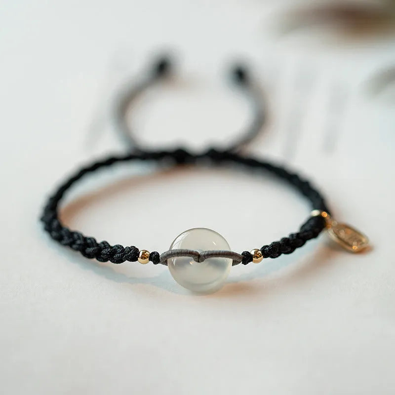 Ethnic-style women's crystal bracelet with woven rope strap and flower-shaped centrepiece