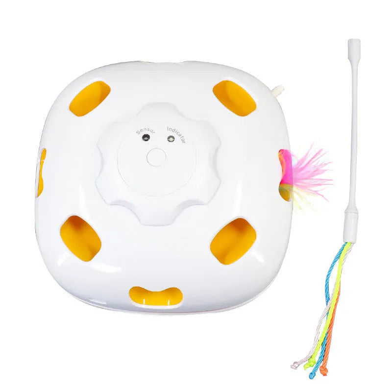 Coloured plastic self-grooming cat teaser toy with a rotating ball for interactive play.
