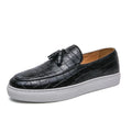 Men's black business casual sneakers with tassel detail on artificial PU upper and rubber sole.