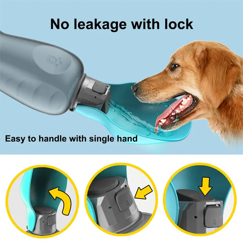 Blue-grey foldable dog water bottle with drinking trough open, showing wrist strap and lock key.