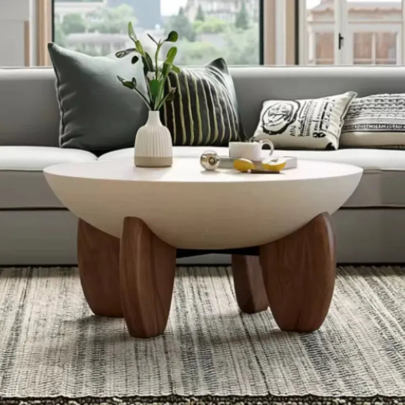 White solid wood adjustable height coffee table with storage, shown in a living room setting.